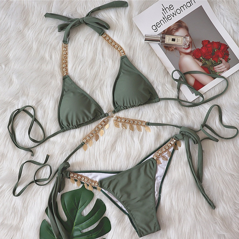 Chain straps gather the split swimsuit