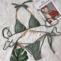 Chain straps gather the split swimsuit
