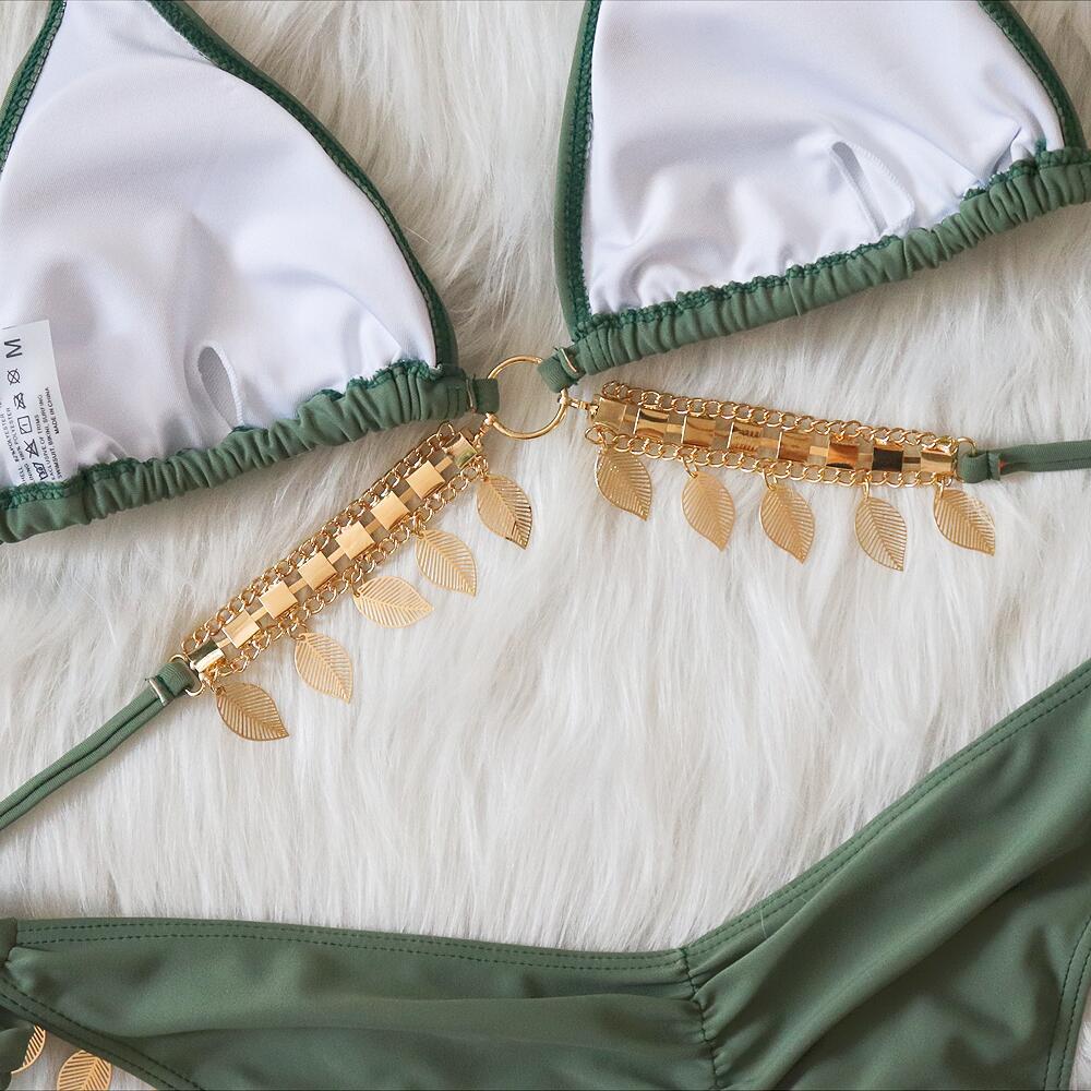 Chain straps gather the split swimsuit