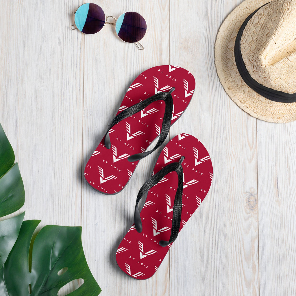 By Adie Logo Pattern Red Flip Flops